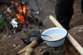 We cooked oatmeal porridge in the forest in the summer